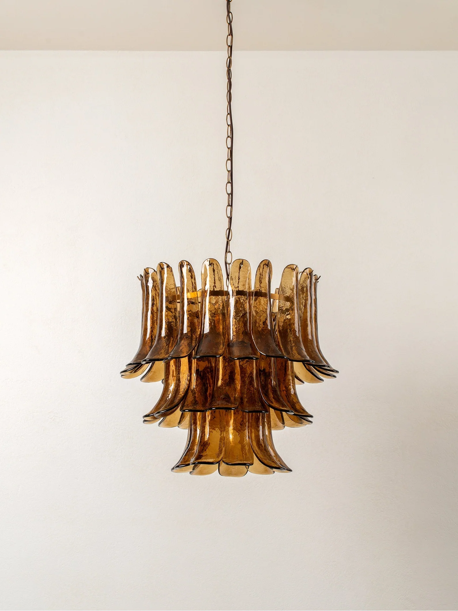 Lonso - 4 light aged brass and smoked brown glass chandelier